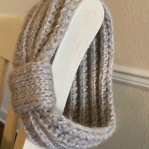 A silver sparkly crocheted headband.